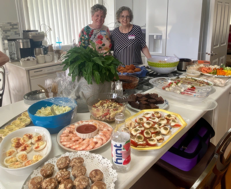 Lissa (left) and Carol Jo with feast