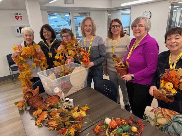 Decorating the Family Promise dining room room for Thanksgiving dinner